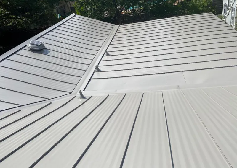 Solar attic fan installed on a metal roof for Roof Ventilation in Hercules